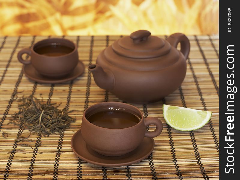 Chinese clay teapot and two cups