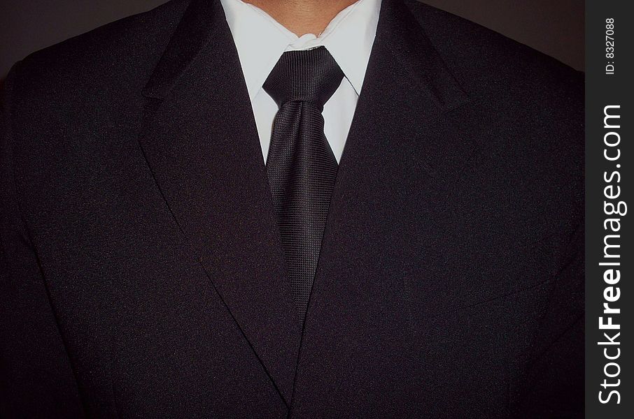 Man dressed for formal event such graduation.