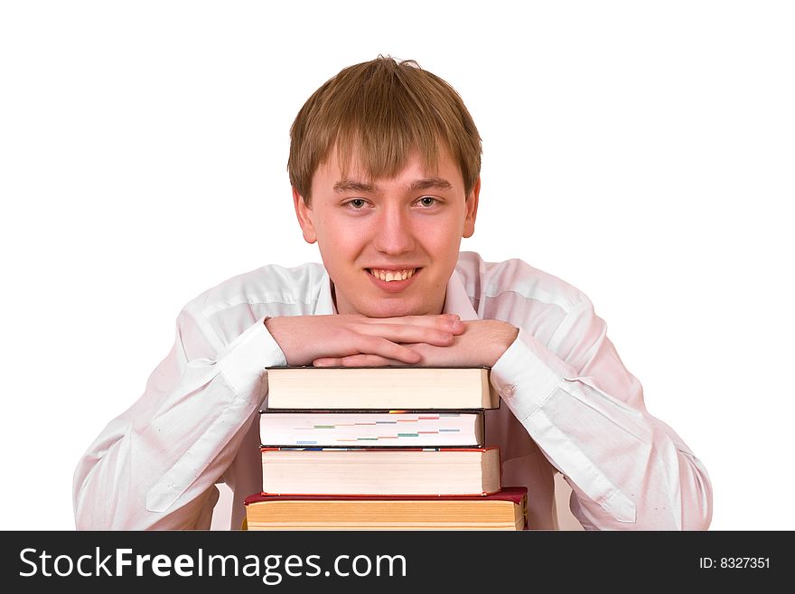 Happy student with many books sitting on white background