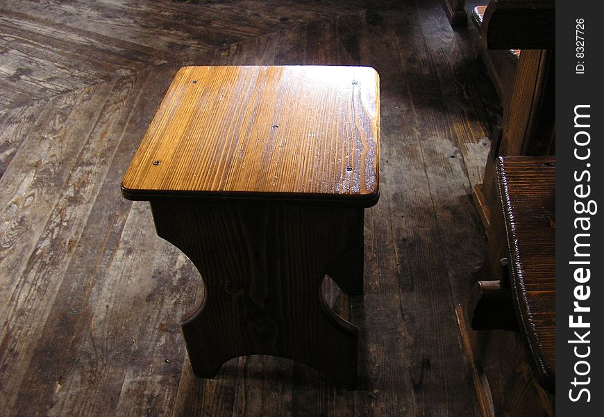 A wooden stool is in the cafe of Carpathians. A wooden stool is in the cafe of Carpathians