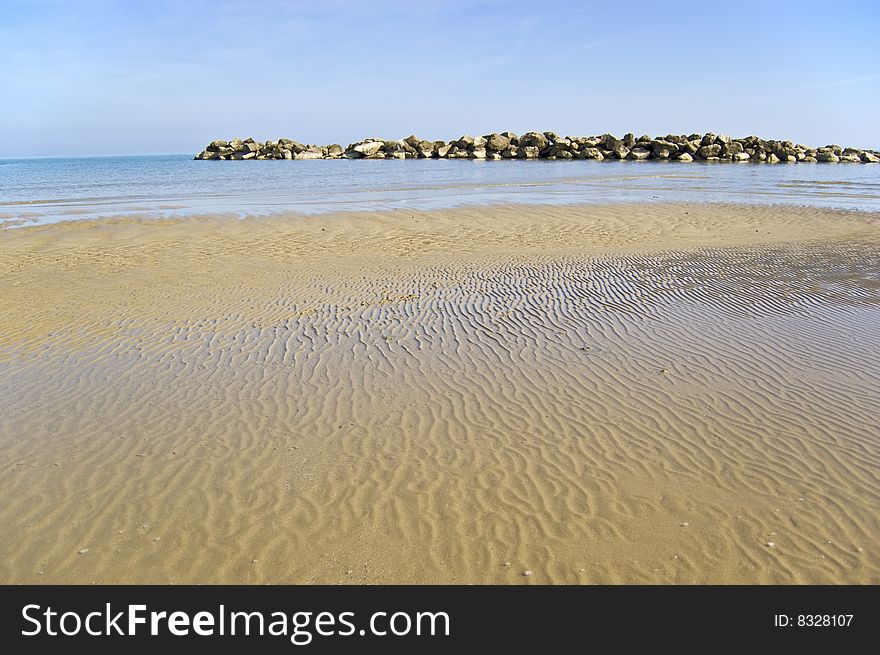 Beach with a stone wall, Adriatic sea, Italy