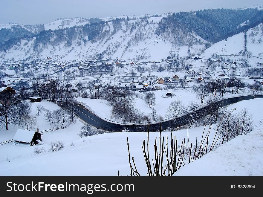 Winter landscape;Trees covered in snow;
A village in the mountains,in Romania. Winter landscape;Trees covered in snow;
A village in the mountains,in Romania