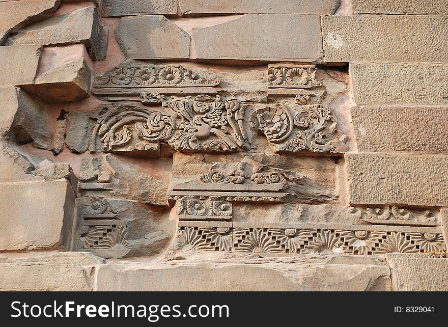 Aged Religious Carve on the brick wall