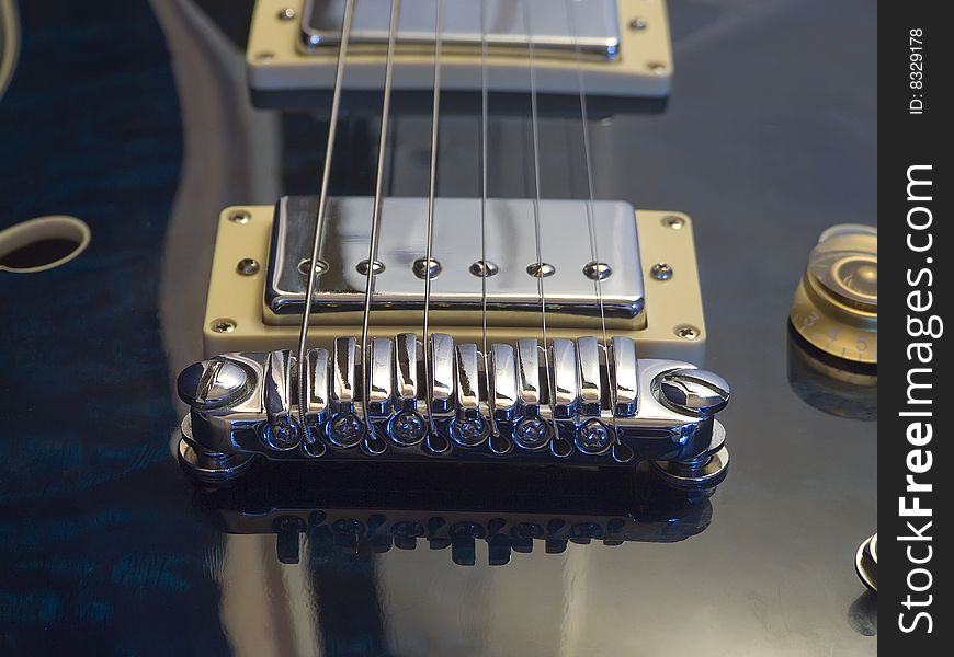 Close-up of the pickups on an electric guitar.