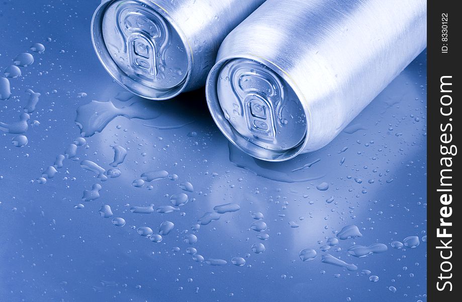 Silver tins and water drops