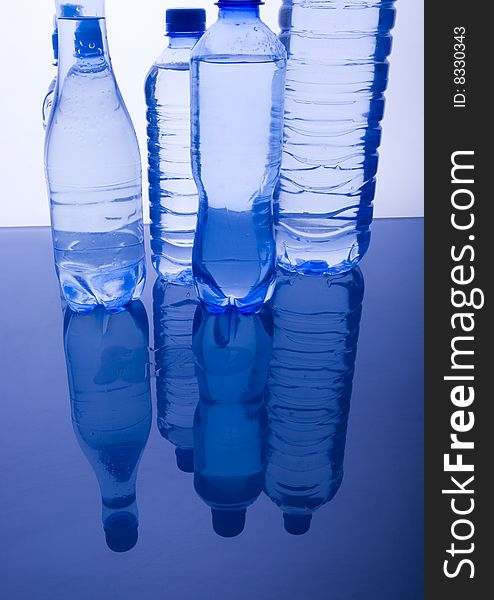 Mineral water in blue bottles