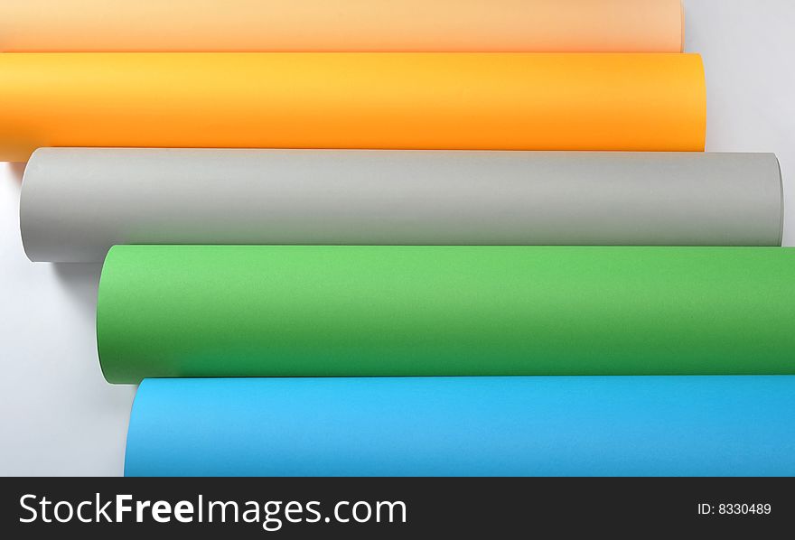 Colored rolled paper in white background