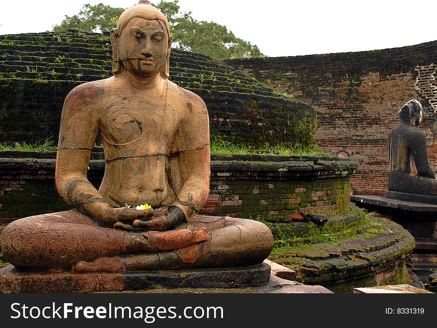 Four statues of seated Buddha are located in the Vatadage ancient house of relic in Polonnaruwa, Sri Lanka. Two of them are shown in the picture. Four statues of seated Buddha are located in the Vatadage ancient house of relic in Polonnaruwa, Sri Lanka. Two of them are shown in the picture.