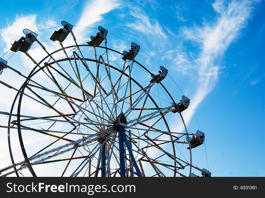 Ferris Wheel on blue sky background