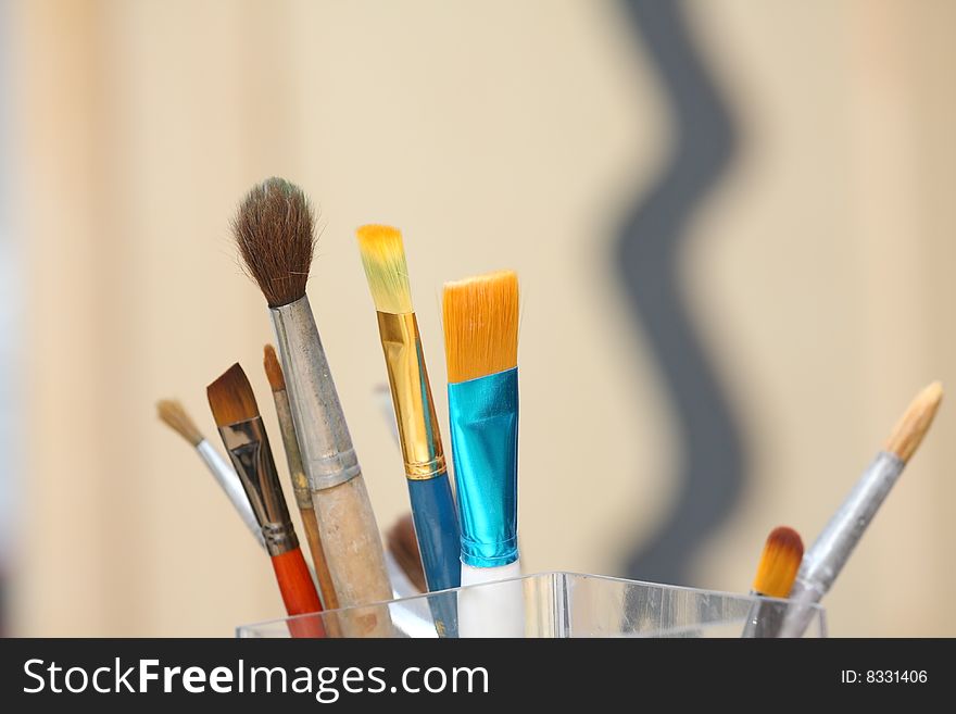 Brushes for drawing standing in a glass jar. Brushes for drawing standing in a glass jar