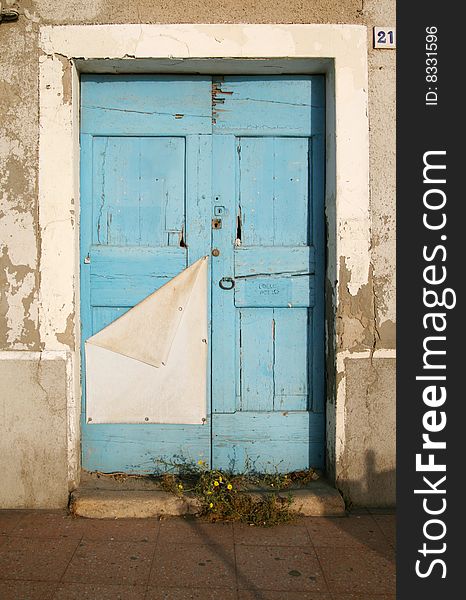 An antique blue wooden door