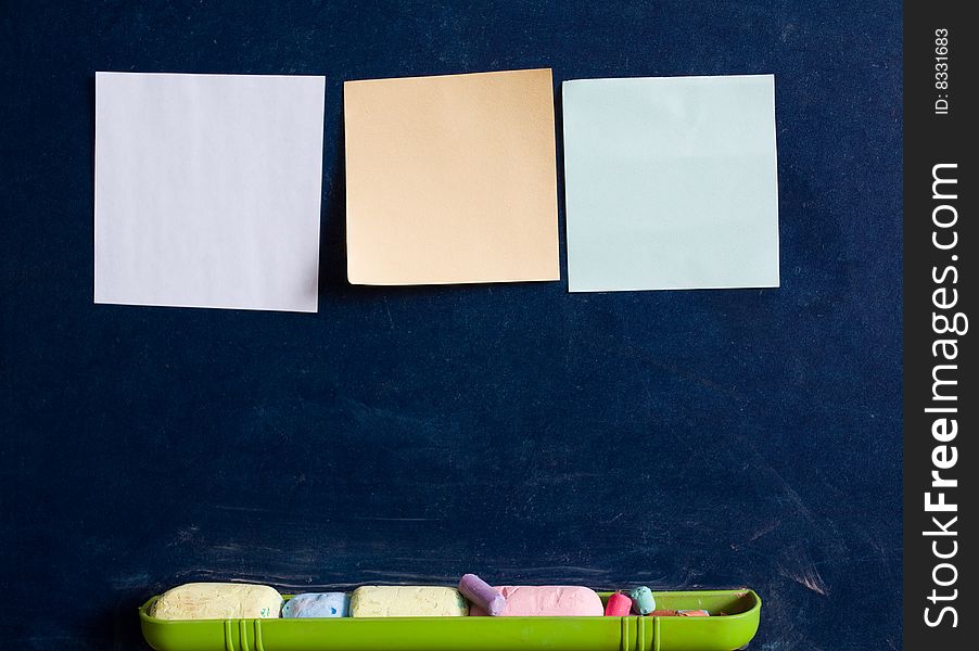 Stock photo: an image of three sheets of paper on blackboard. Stock photo: an image of three sheets of paper on blackboard