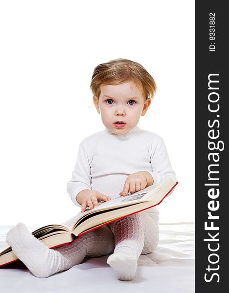 Stock photo: an image of a baby with a big book