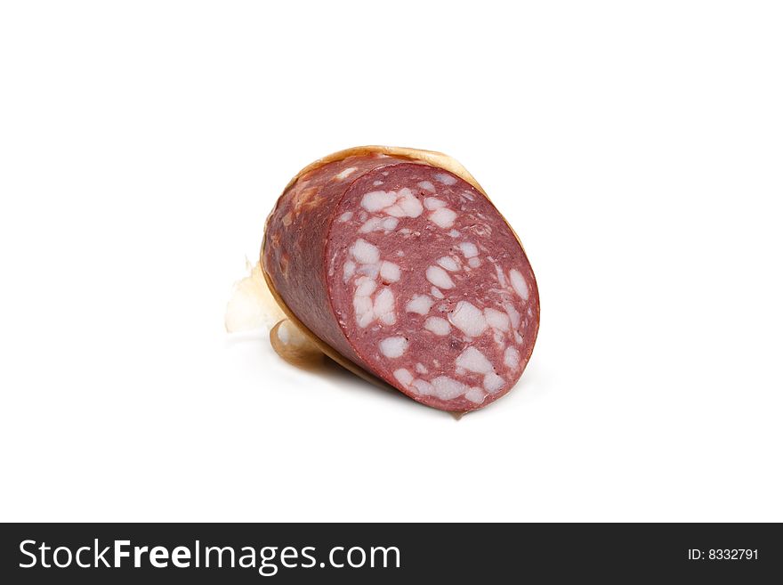 Piece of the cleaned sausage insulated on white background. Piece of the cleaned sausage insulated on white background