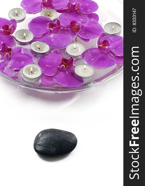 Therapy stones and floral scented water with candle. Therapy stones and floral scented water with candle