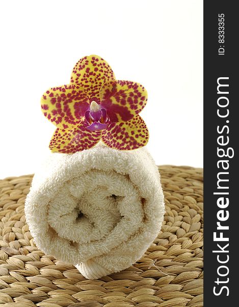 Beautiful orchid , towel on mat. Beautiful orchid , towel on mat