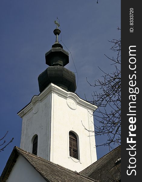 Spire of reformed church in village musem in Szenna, Hungary, Central Europe. Spire of reformed church in village musem in Szenna, Hungary, Central Europe