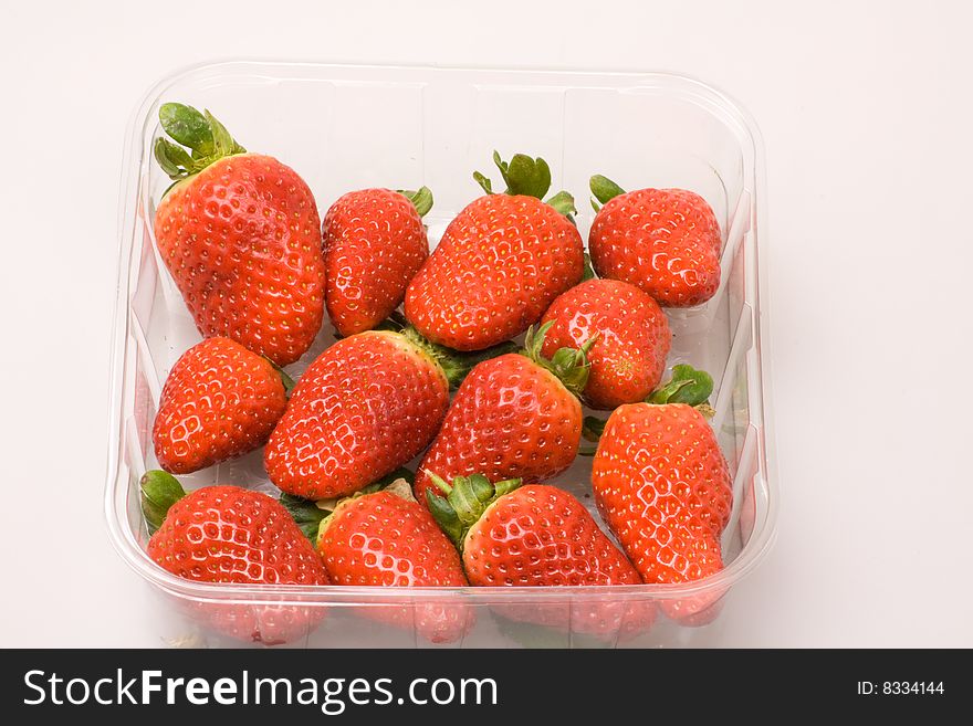 Pummet of  strawberries on a white background. Pummet of  strawberries on a white background