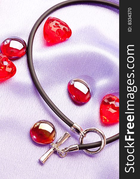 Holiday series: red glassy decoration and silver penedent for valentine day. Holiday series: red glassy decoration and silver penedent for valentine day