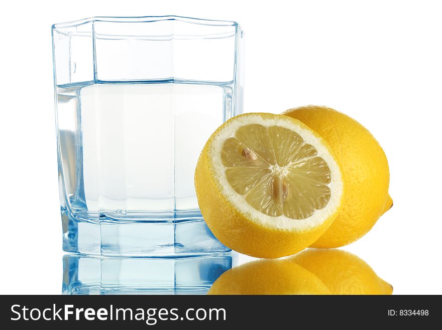 Fresh water in glass and lemons