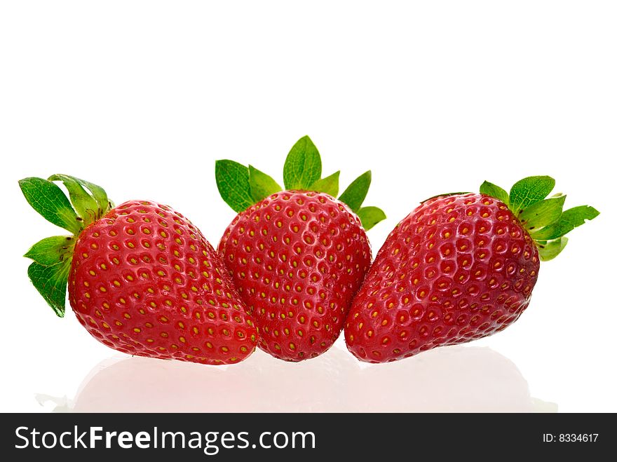 Three delicious strawberries isolated on white background with copy space.