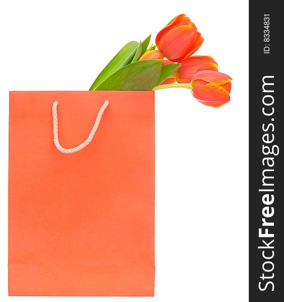 Red shopping bag with tulips isolated on white. Red shopping bag with tulips isolated on white.