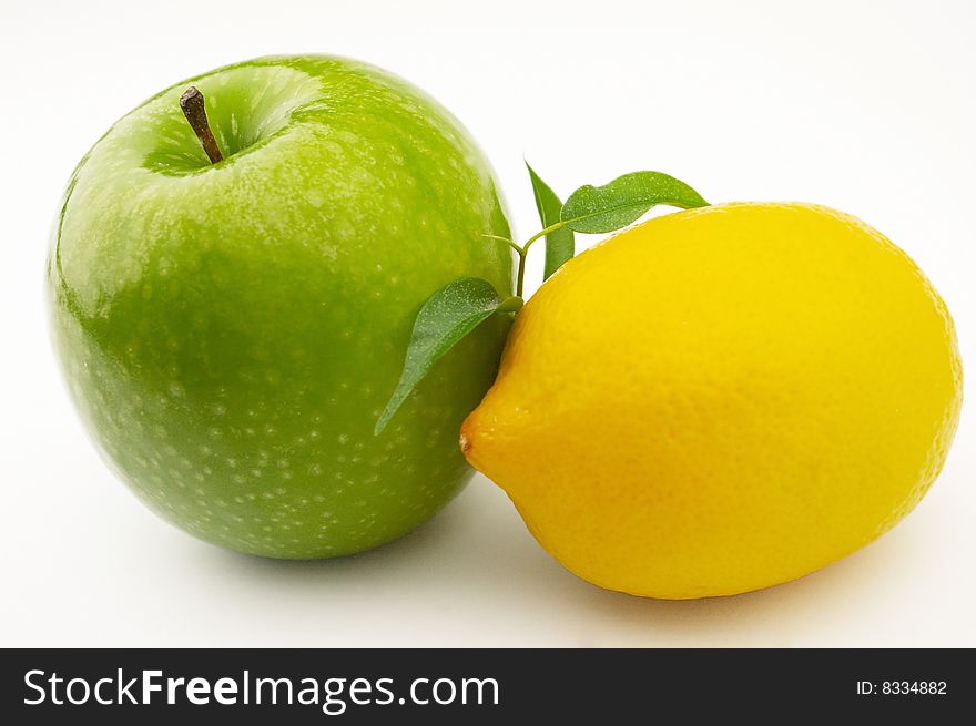 Apple and lemon on a white background