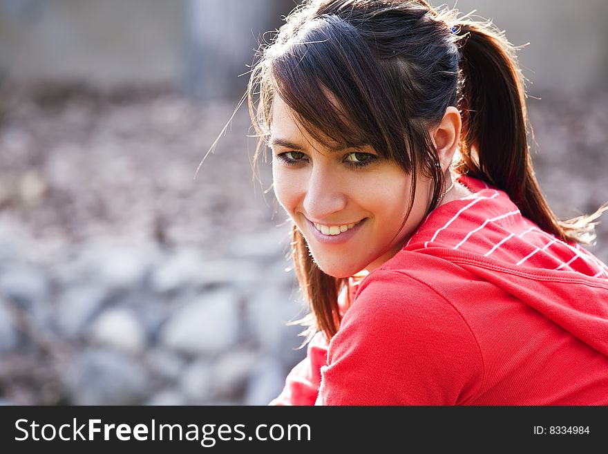 Smiling young girl staring at camera. Smiling young girl staring at camera.