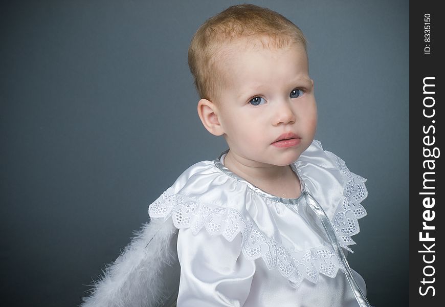 Baby angel girl with fluffy wings