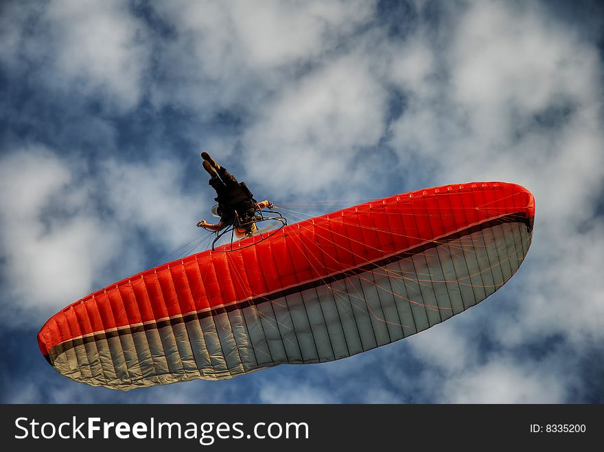 Paraglider on the blue sky