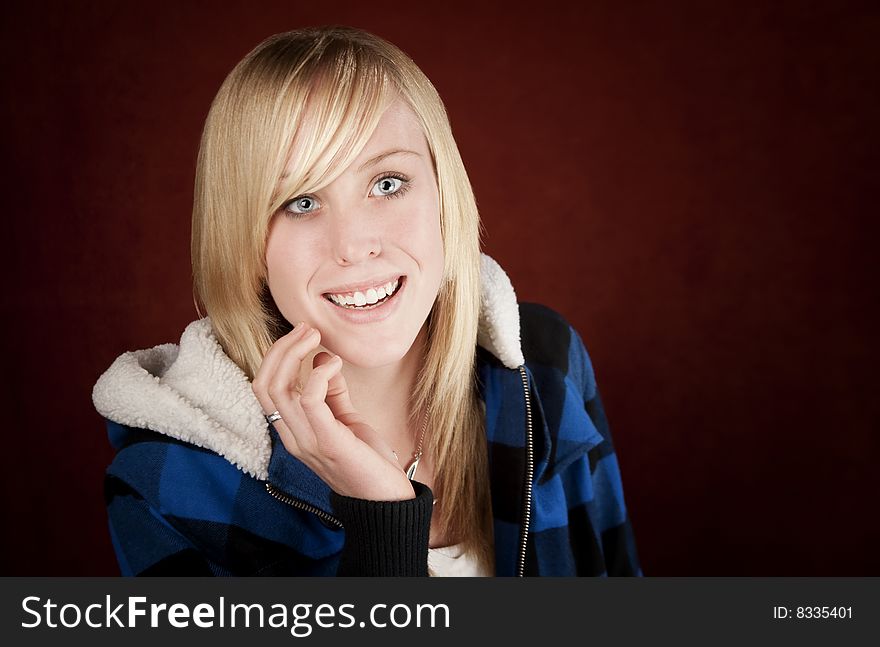 Pretty young blonde teenage girl in blue jacket. Pretty young blonde teenage girl in blue jacket