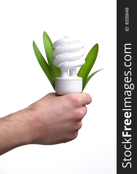 Person holding a modern green light bulb