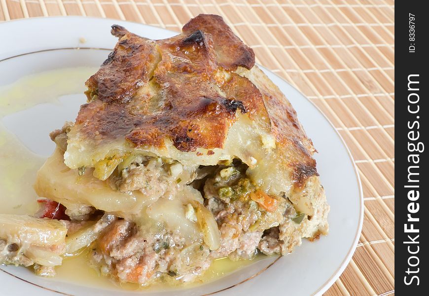 Baked pudding from a potato with the meat stuffing