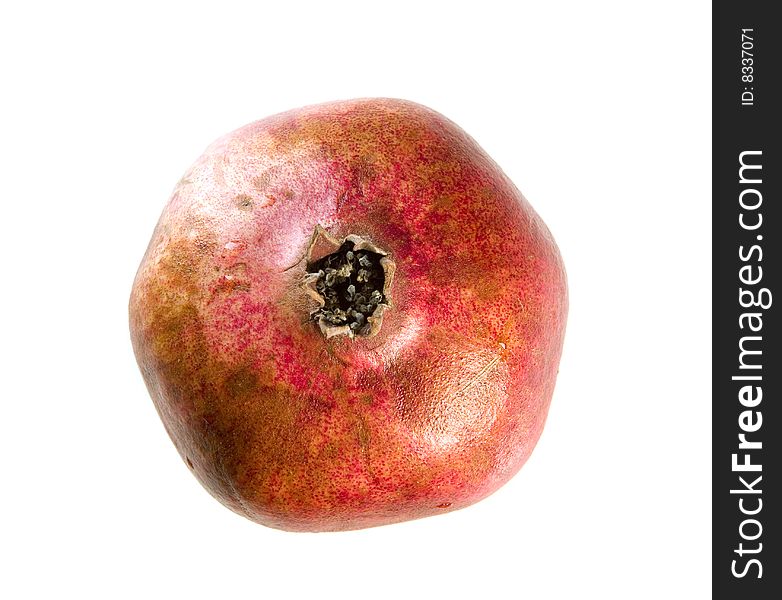 Ripe pomegranate on white ground