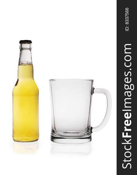 Beer bottle and glass isolated on white background