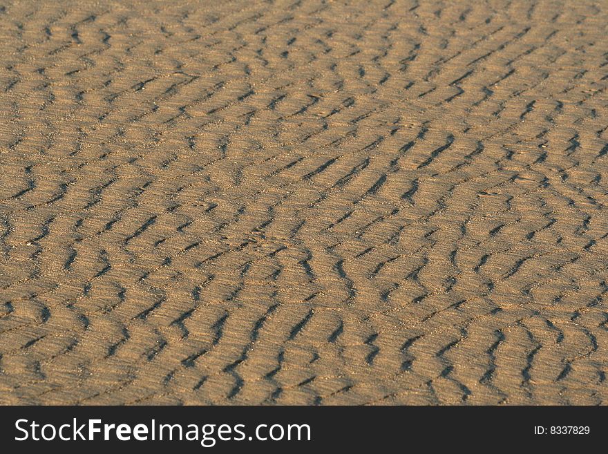 Sun and shade on the riffles on the beach. Sun and shade on the riffles on the beach.