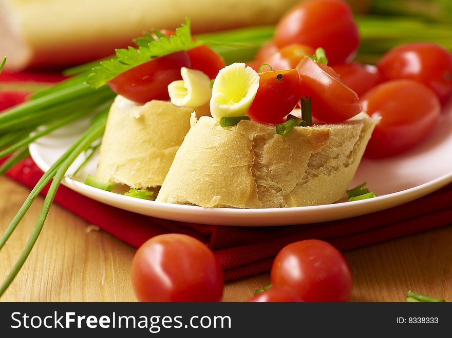 Baguette with tomatoes,butter and chive. Baguette with tomatoes,butter and chive