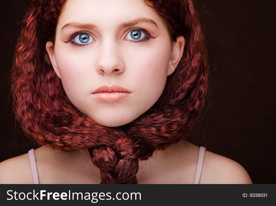 Pretty young girl with red tied hair