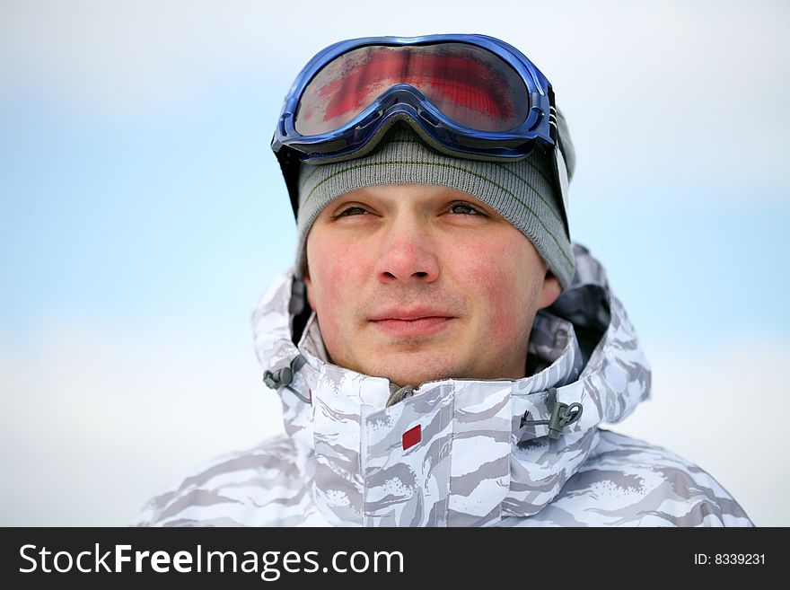 Snowboarder portrait. Winter day photo.