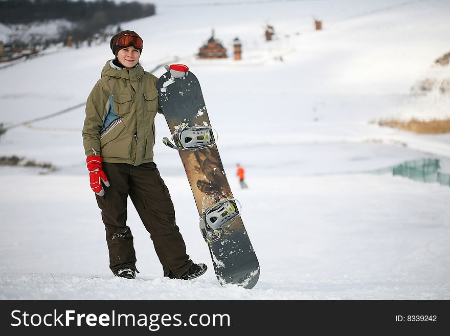 Young adult female snowboarder. winter