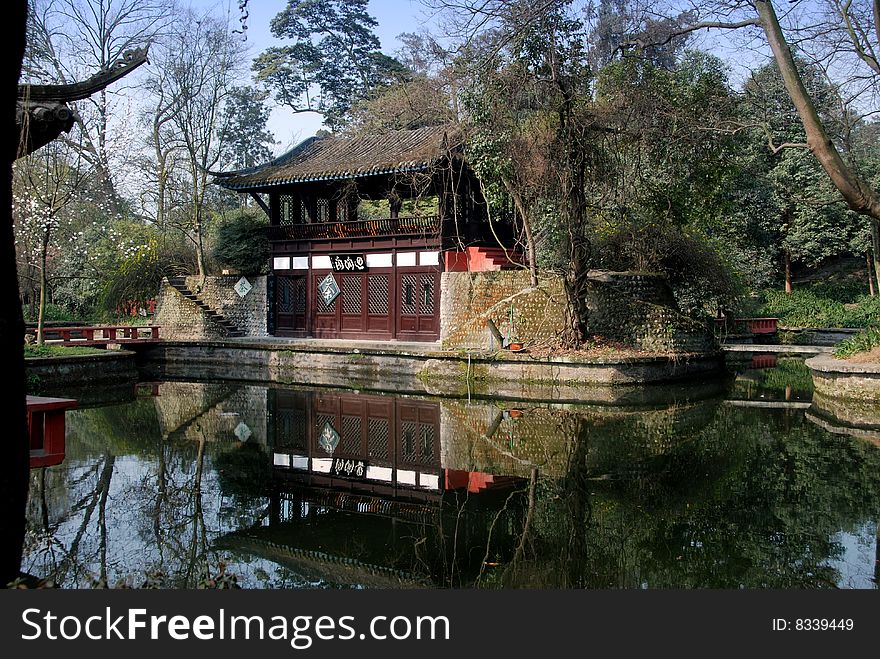 A traditional Chinese teahouse overlooks a lagoon in Wang Cong Ci Park in Pixian, Sichuan Province, China - Lee Snider Photo. A traditional Chinese teahouse overlooks a lagoon in Wang Cong Ci Park in Pixian, Sichuan Province, China - Lee Snider Photo.