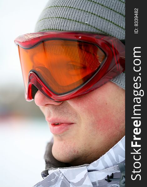 Snowboarder looking in goggles