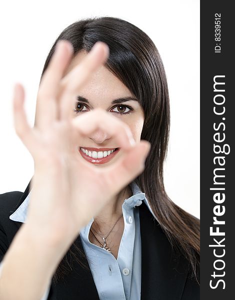 Businesswoman showing ok sign on white background