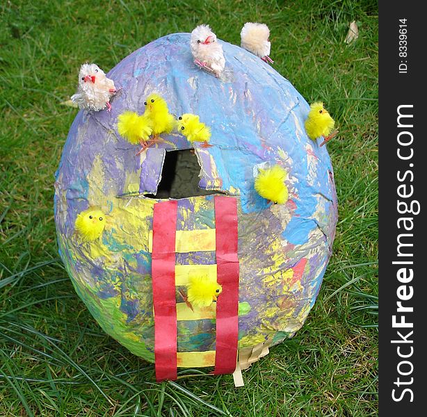 Â  paper easter egg with chicken in a sunny gardenÂ 