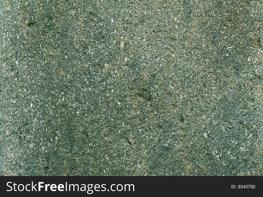 Pebble rock texture on green colors for background. Pebble rock texture on green colors for background