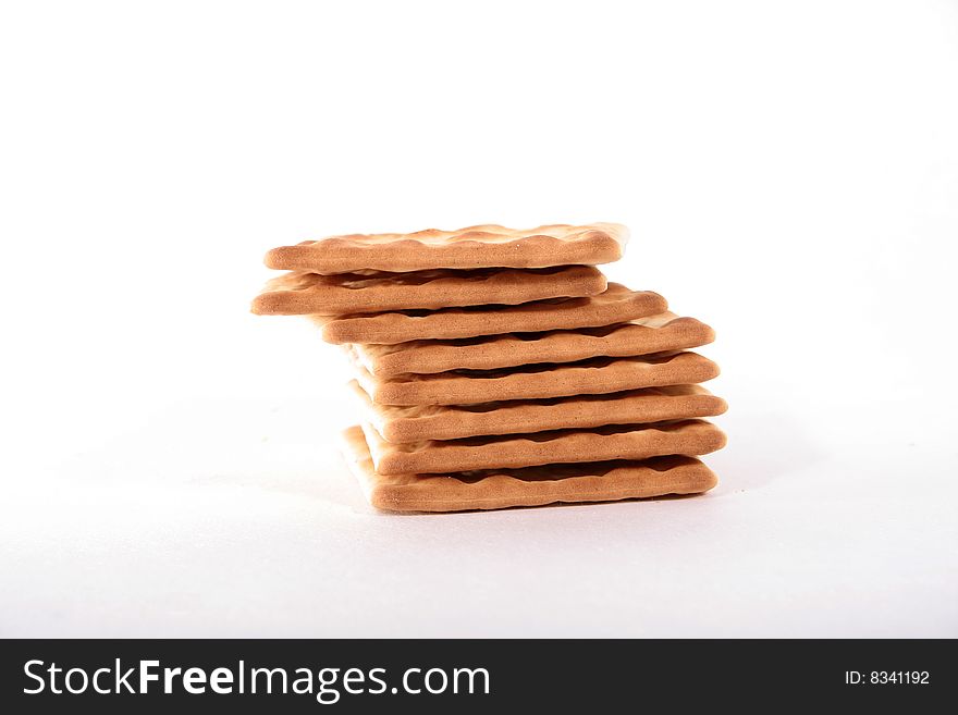 A stack of crackers on a white background. A stack of crackers on a white background.