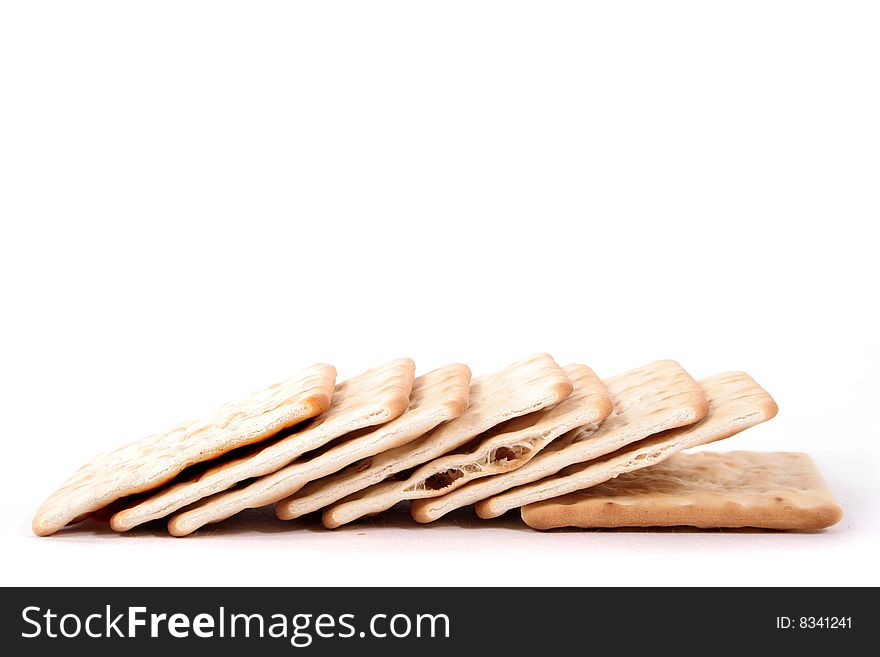 A stack of crackers on a white background. A stack of crackers on a white background.