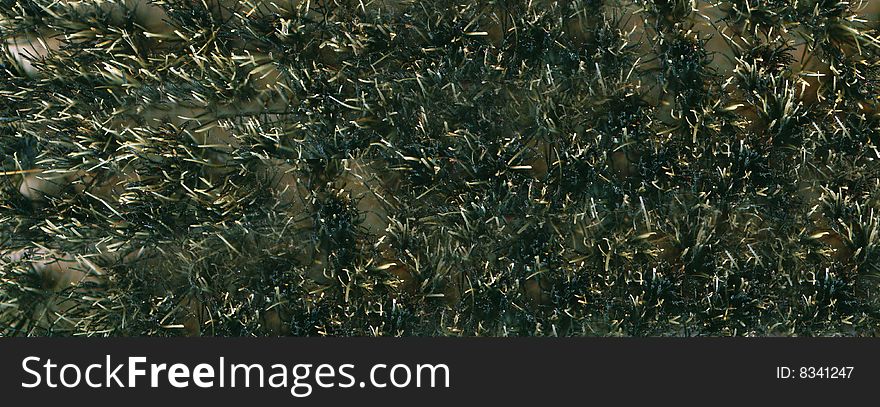 A scrub brush with polyester bristles background. A scrub brush with polyester bristles background.