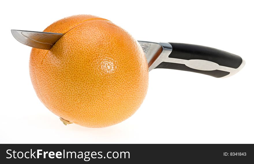Grapefruit with damascus steel knife over isolated on white. Grapefruit with damascus steel knife over isolated on white
