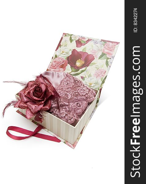 Gift box with silk woman's underwear and textile rose isolated on white background. Gift box with silk woman's underwear and textile rose isolated on white background.